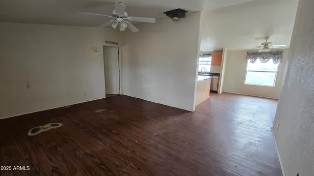 a kitchen with granite countertop stainless steel appliances a refrigerator microwave and sink