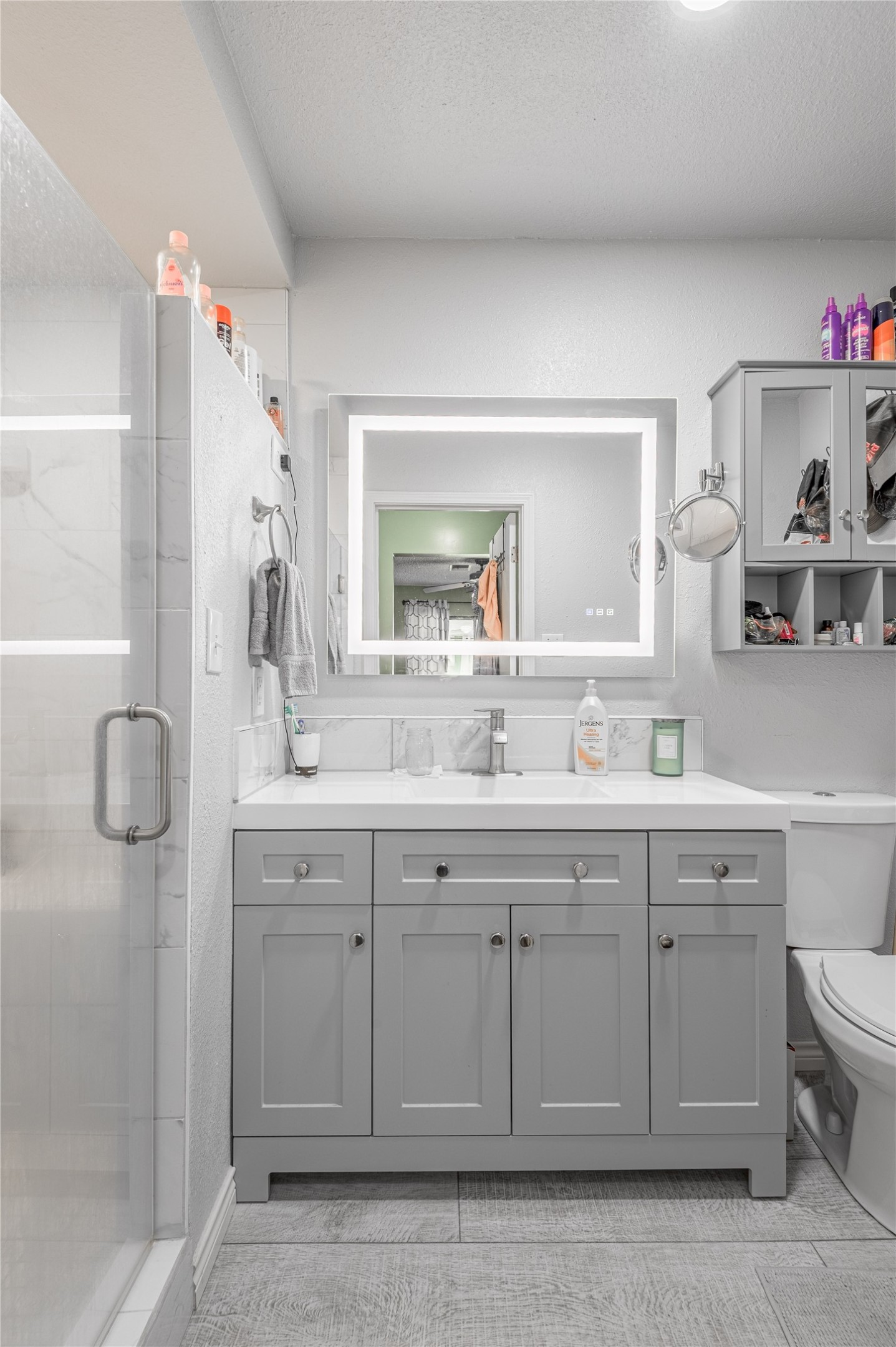 37 Spreading Oak Trinity, TX 75862 - Photo 12 of 21 a bathroom with a sink vanity toilet and shower