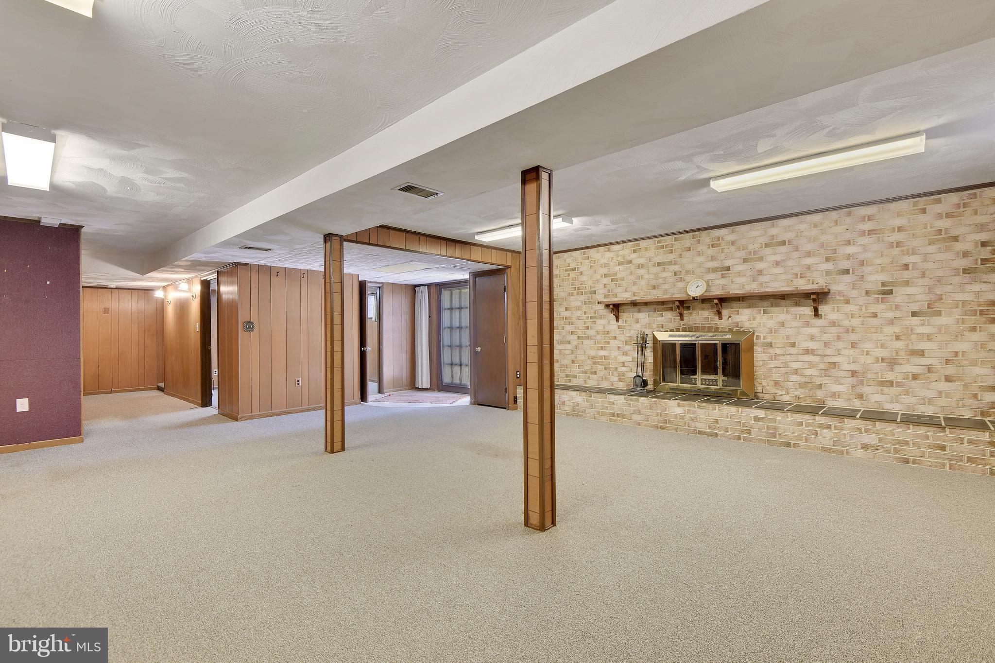 1416 Gilbert Road Arnold, MD 21012 - Photo 17 of 30 Rec Room with Wood-burning Fireplace