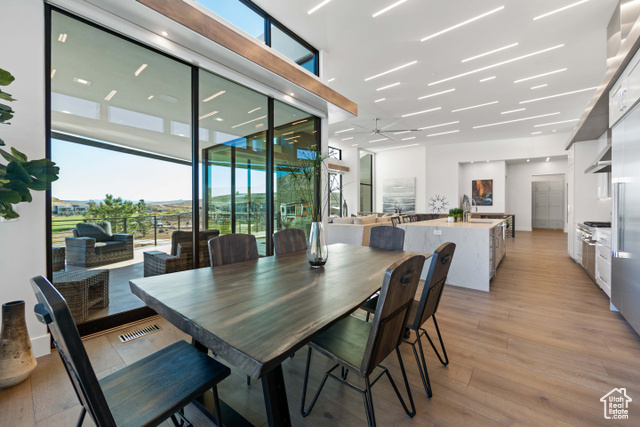 3558 South Cypress Road Hurricane, UT 84737 - Photo 12 of 57 Dining area featuring sink, ceiling fan, light hardwood / wood-style floors, and expansive windows