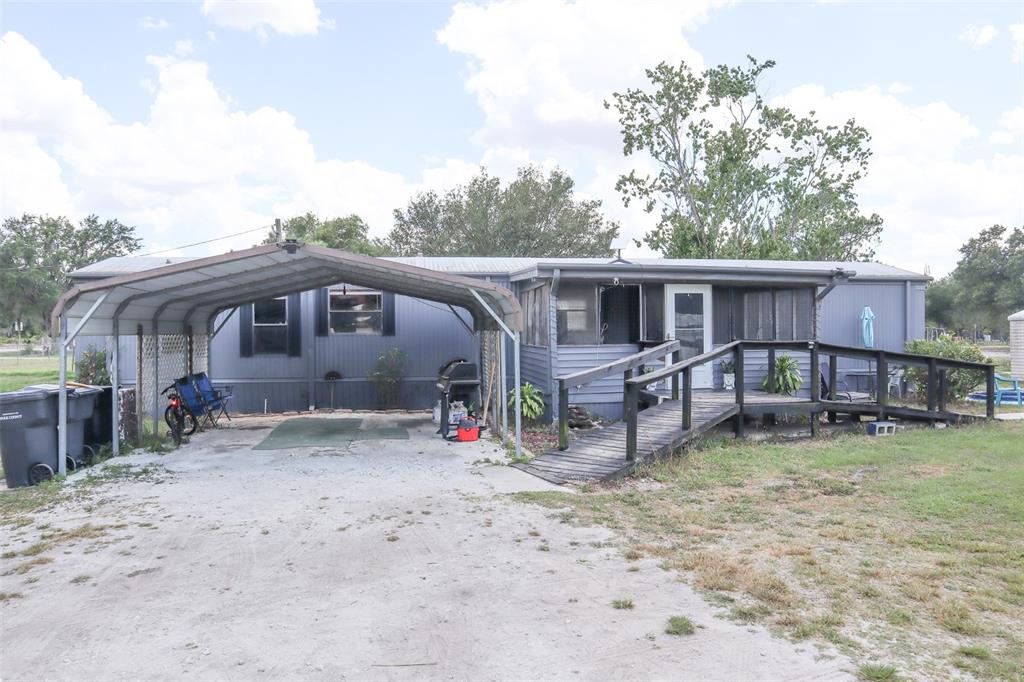 1008 Dawes Road Frostproof, FL 33843 - Photo 1 of 1 a view of a house with backyard