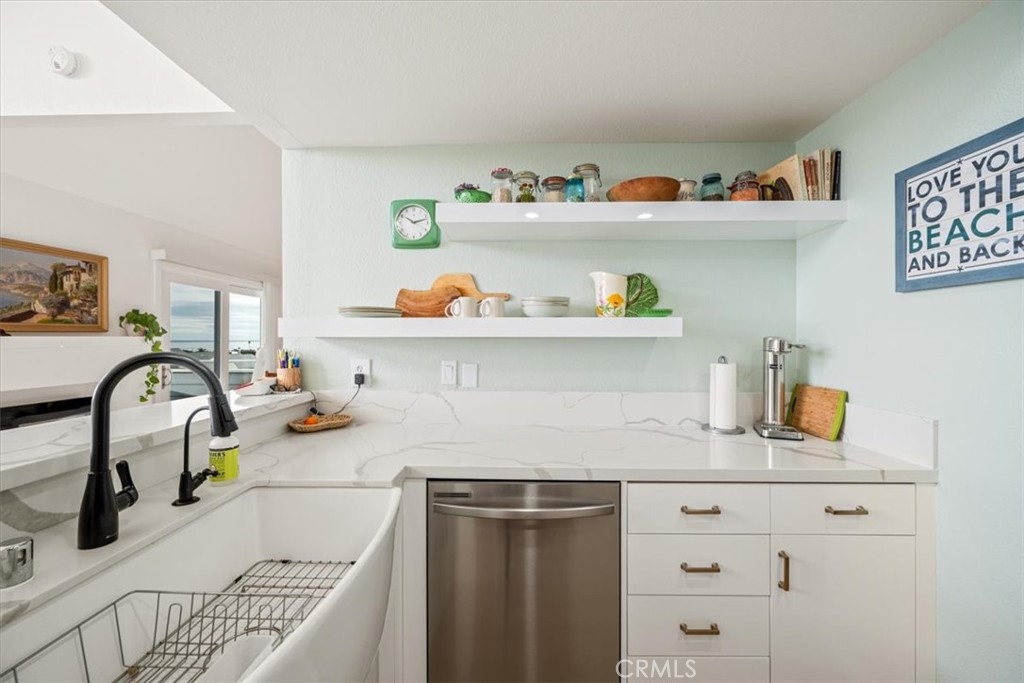 428 Westpoint Drive Pismo Beach, CA 93449 - Photo 13 of 58 a kitchen with a refrigerator and a sink