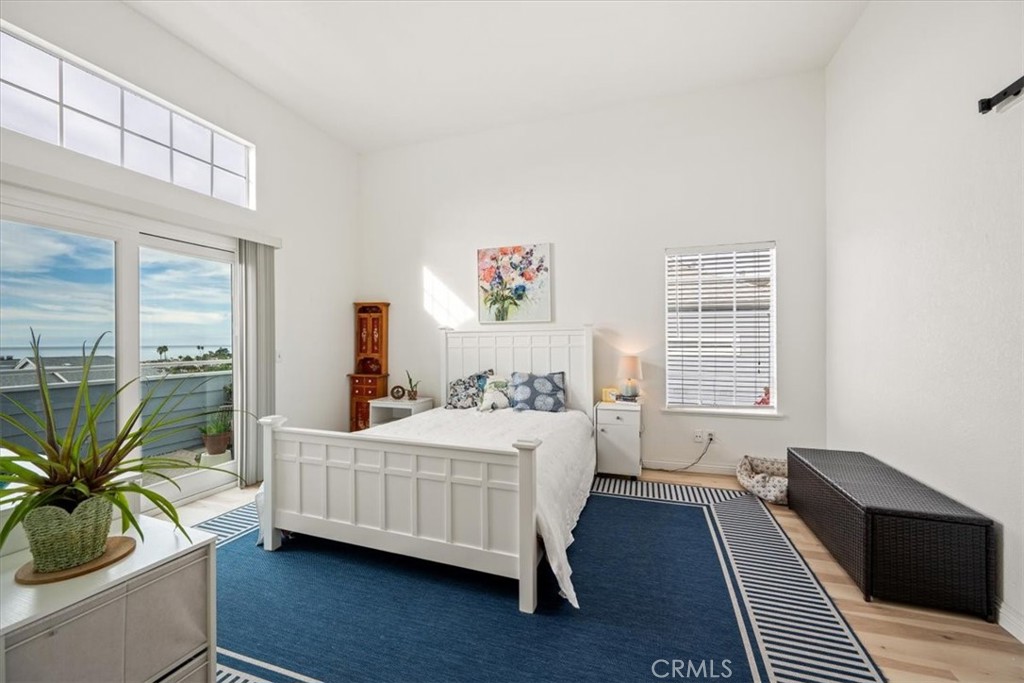 428 Westpoint Drive Pismo Beach, CA 93449 - Photo 15 of 58 a bedroom with a bed wooden floor and window