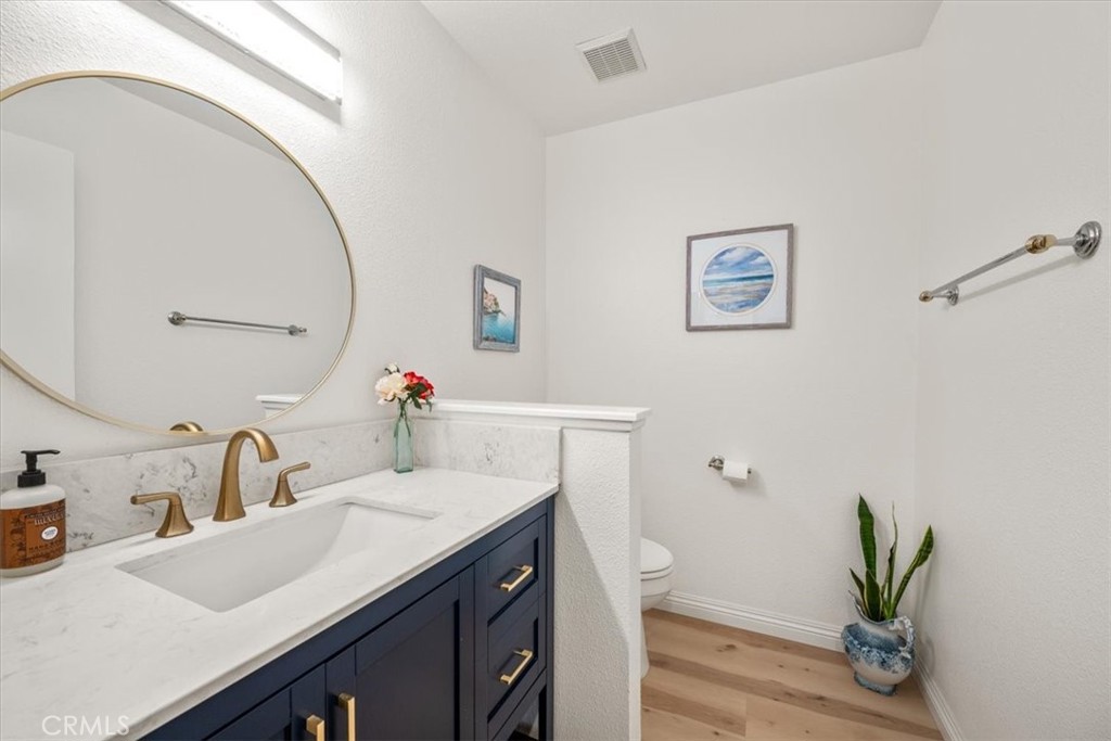 428 Westpoint Drive Pismo Beach, CA 93449 - Photo 24 of 58 a bathroom with a sink a vanity and a mirror