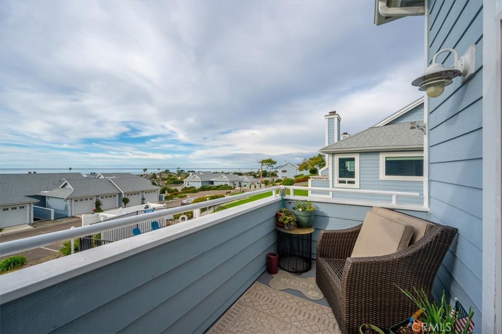 428 Westpoint Drive Pismo Beach, CA 93449 - Photo 41 of 58 a view of a balcony with chairs and a potted plant