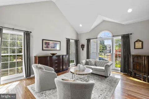 a living room with furniture and a rug