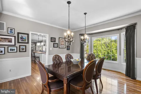 a dining room with furniture window wooden floor