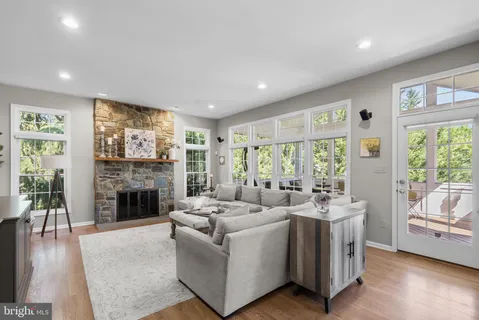 a living room with fireplace furniture and a flat screen tv