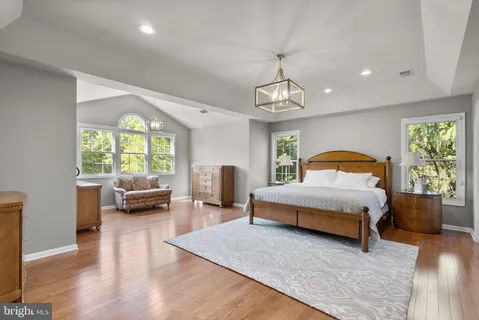 a bed room with a bed window and a television
