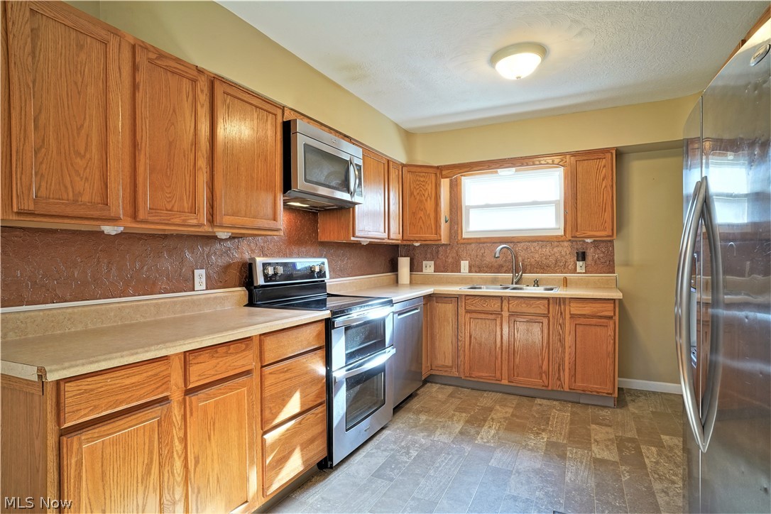 Kitchen with lots of cabinets and pantry.