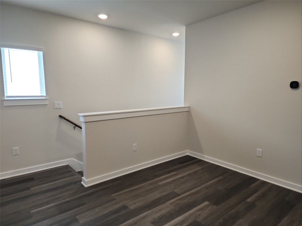 2349 Moon Tower Trail Leander, TX 78641 - Photo 16 of 34 a view of an empty room with wooden floor and window
