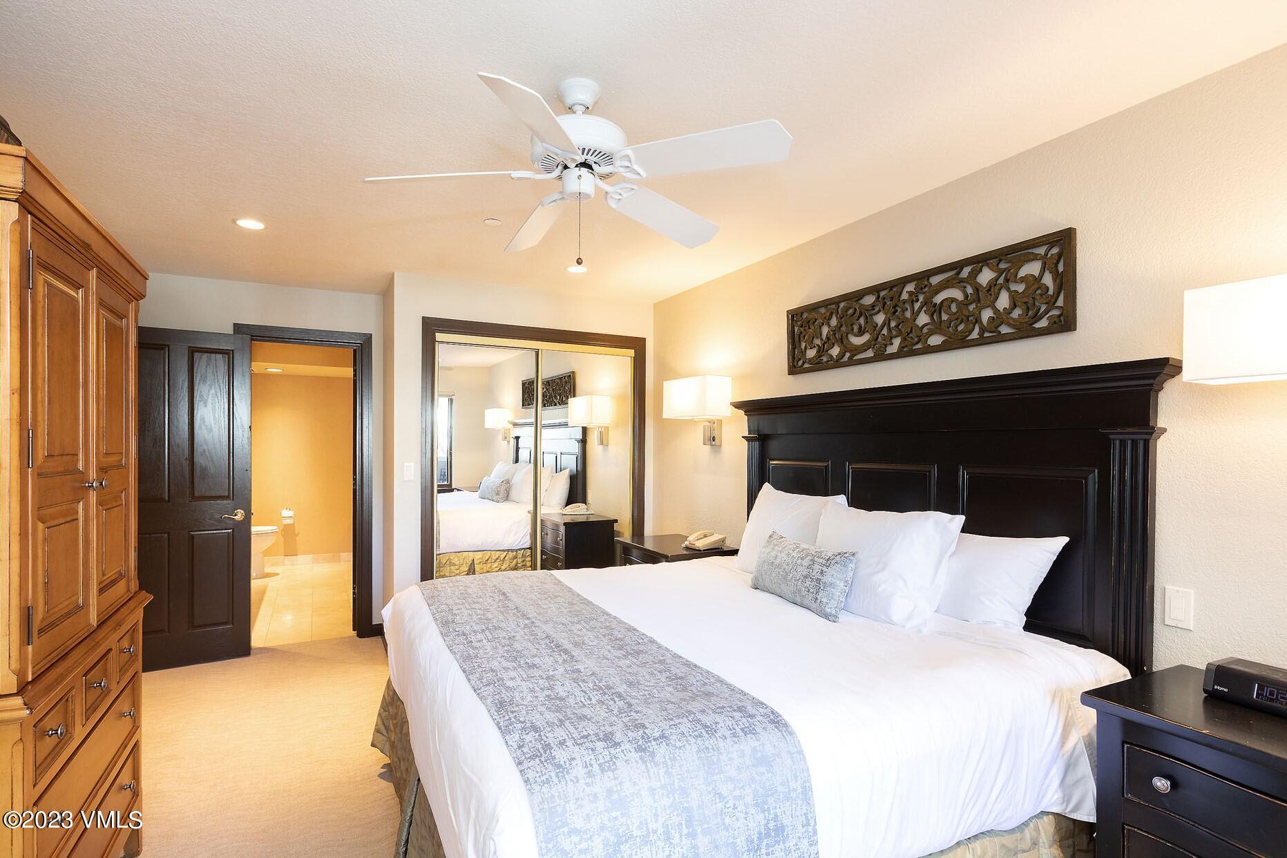 210 Offerson Road, Unit 115 WEEK 33 Beaver Creek, CO 81620 - Photo 16 of 23 a bedroom with a bed and a chandelier