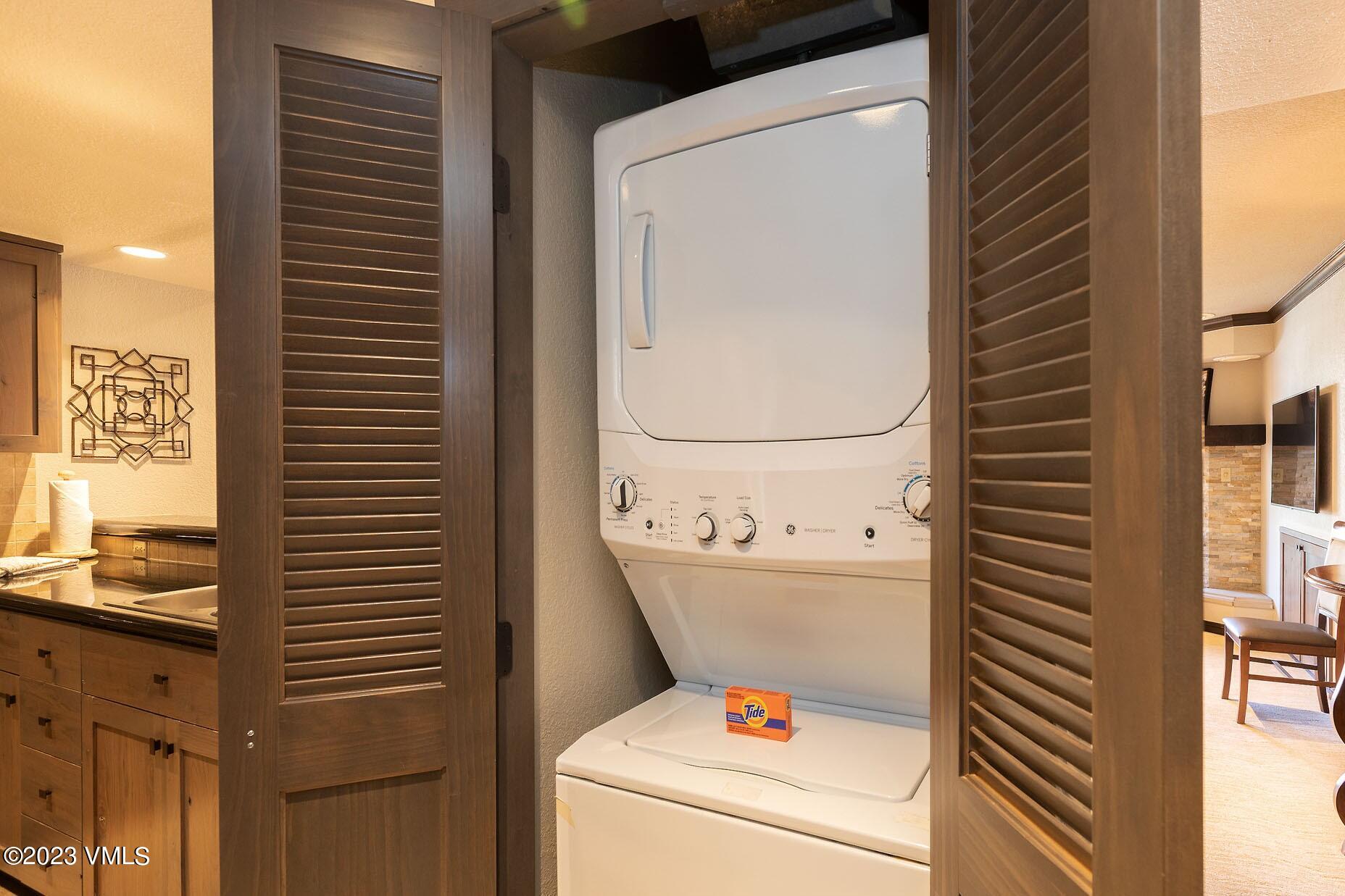 210 Offerson Road, Unit 115 WEEK 33 Beaver Creek, CO 81620 - Photo 21 of 23 a utility room with dryer and washer
