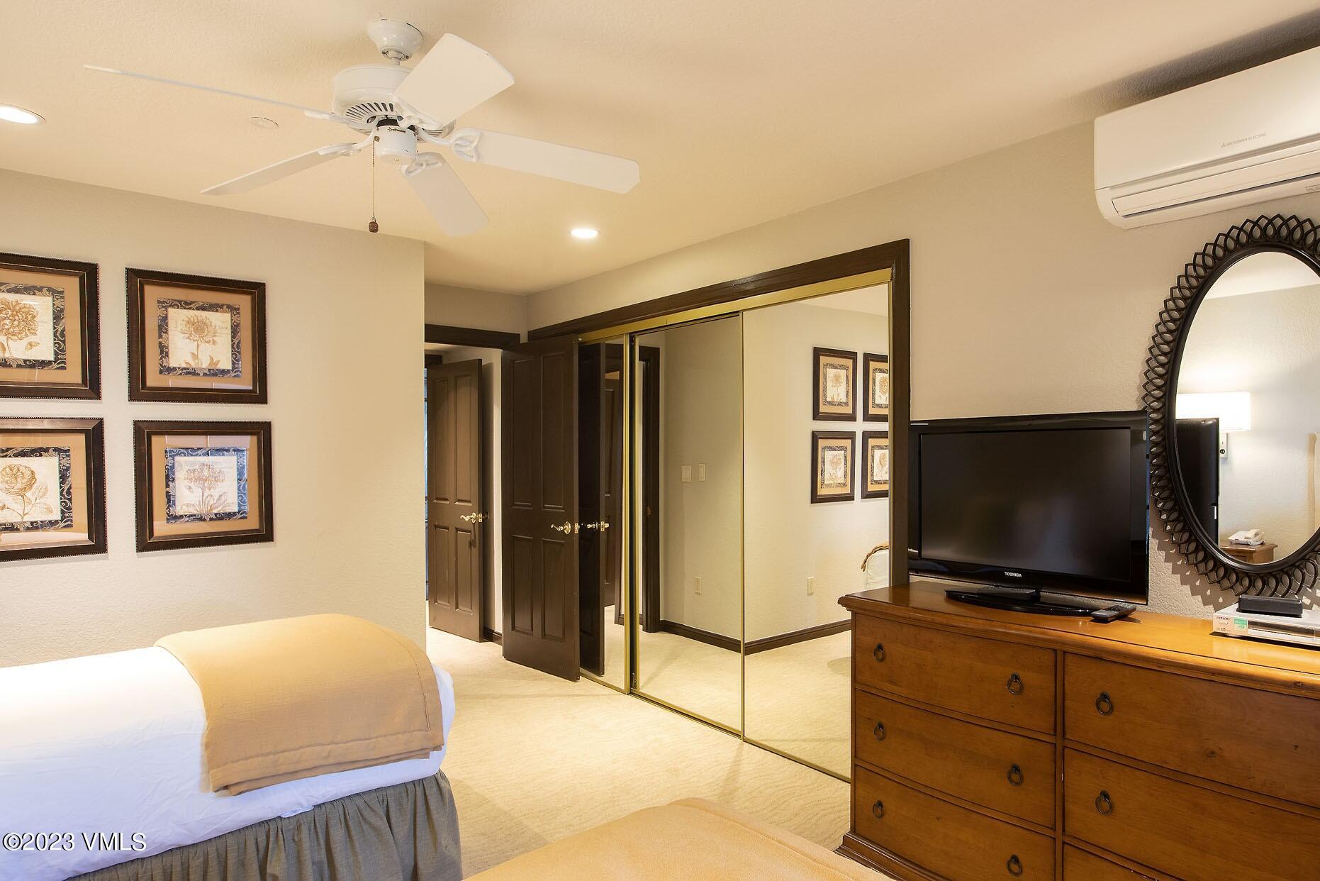 210 Offerson Road, Unit 115 WEEK 33 Beaver Creek, CO 81620 - Photo 10 of 23 a bedroom with a bed and a flat screen tv