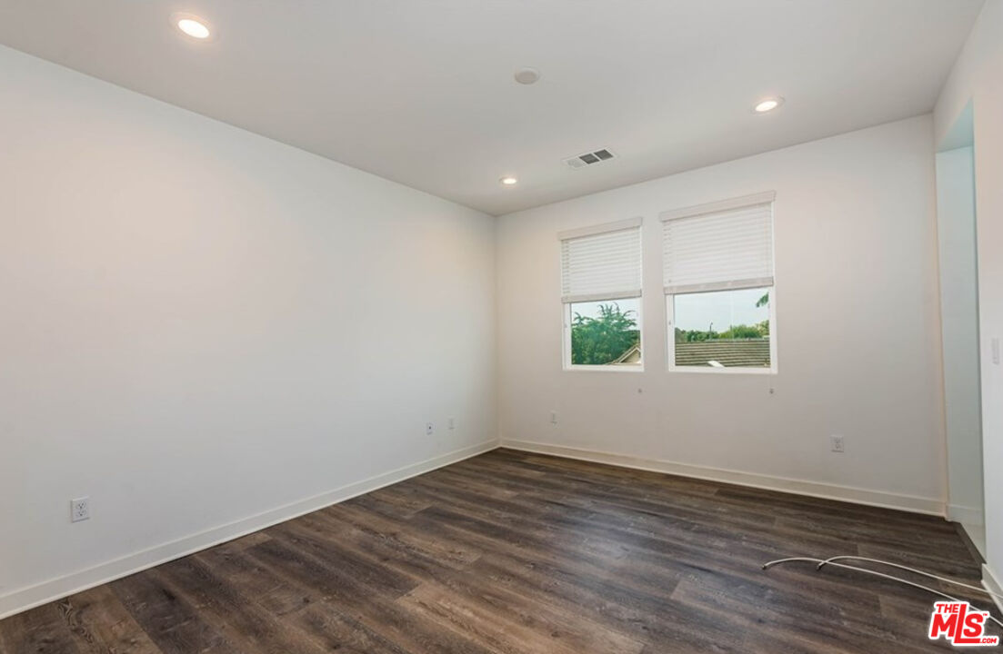 5304 Harvard Way Cypress, CA 90630 - Photo 13 of 29 a view of room with window and wooden floor