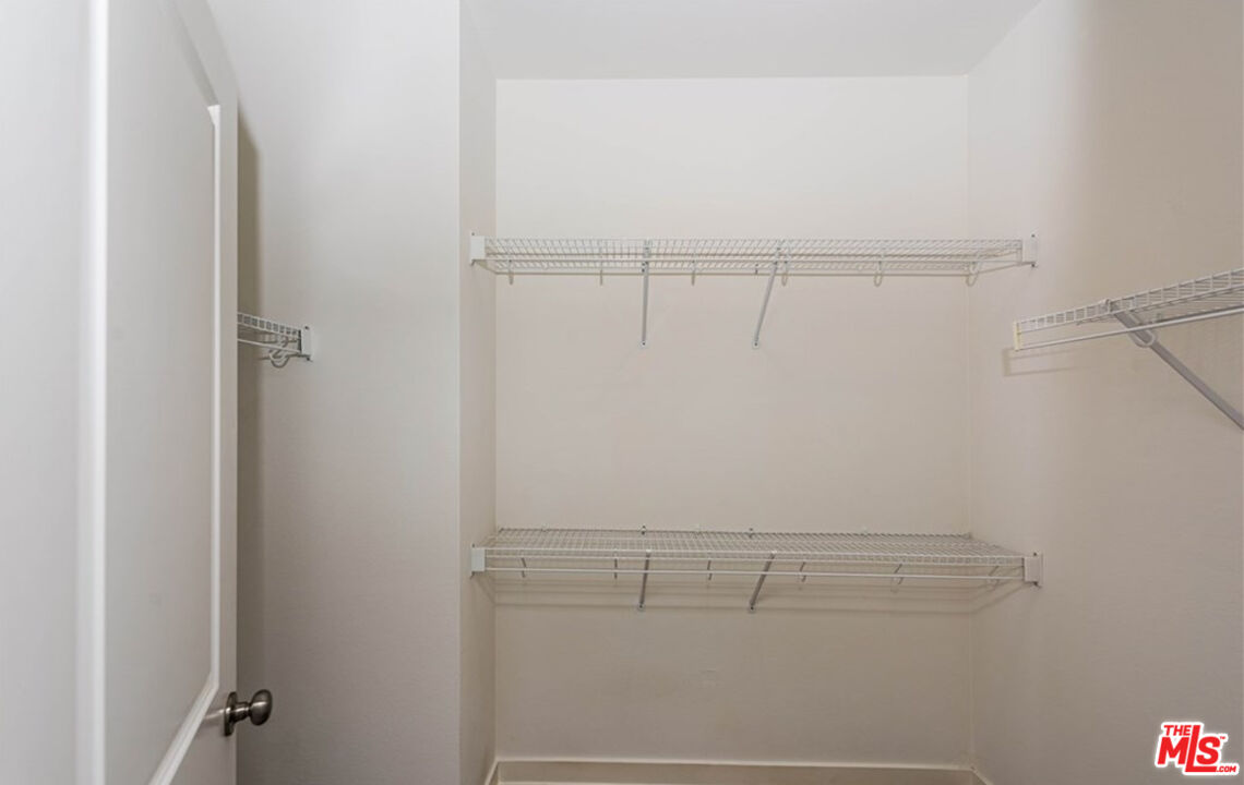 5304 Harvard Way Cypress, CA 90630 - Photo 17 of 29 a view of small space with racks on the wall