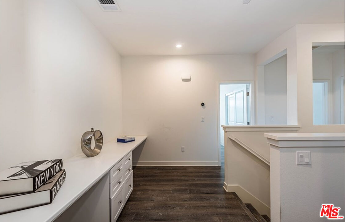 5304 Harvard Way Cypress, CA 90630 - Photo 22 of 29 a bathroom with a sink and a mirror