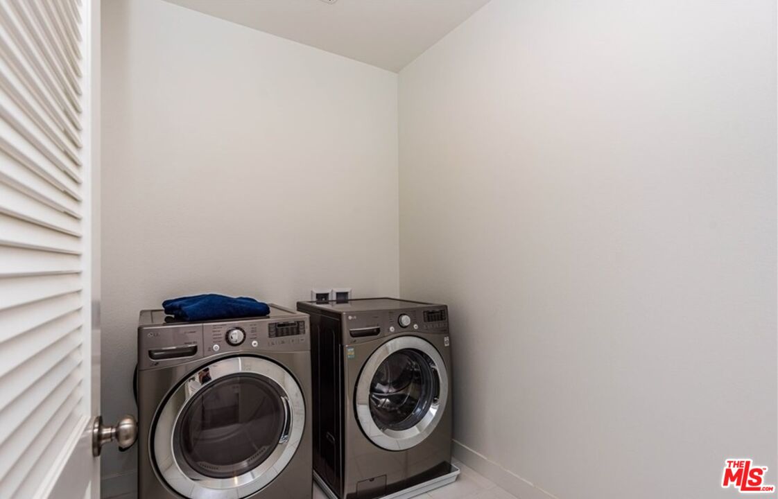 5304 Harvard Way Cypress, CA 90630 - Photo 24 of 29 a utility room with dryer and washer