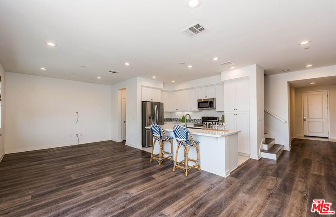 5304 Harvard Way Cypress, CA 90630 - Photo 6 of 29 a view of kitchen with sink microwave and stove