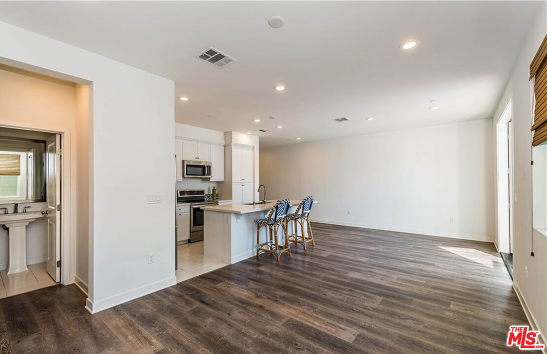 5304 Harvard Way Cypress, CA 90630 - Photo 7 of 29 a view of kitchen with microwave and refrigerator