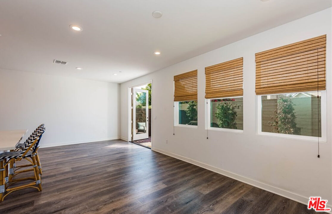 5304 Harvard Way Cypress, CA 90630 - Photo 9 of 29 a view of an empty room with wooden floor and a window