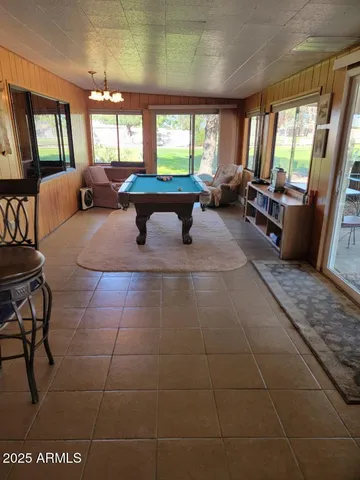 a view of a patio with table and chairs