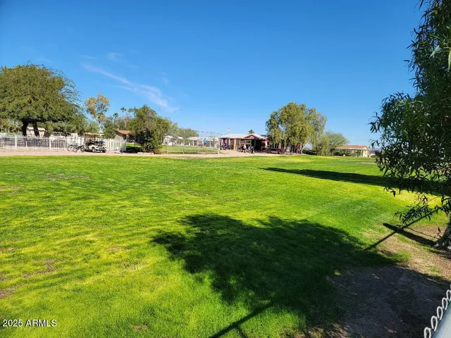 a view of a house with a wooden fence