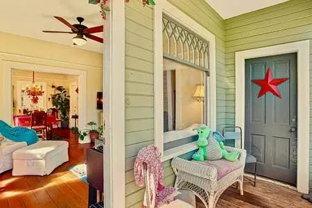 a view of front door of house with potted plant