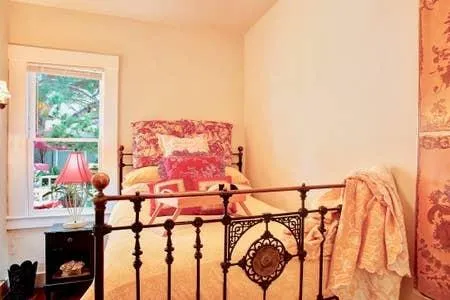 a picture of a room with furniture and a potted plant