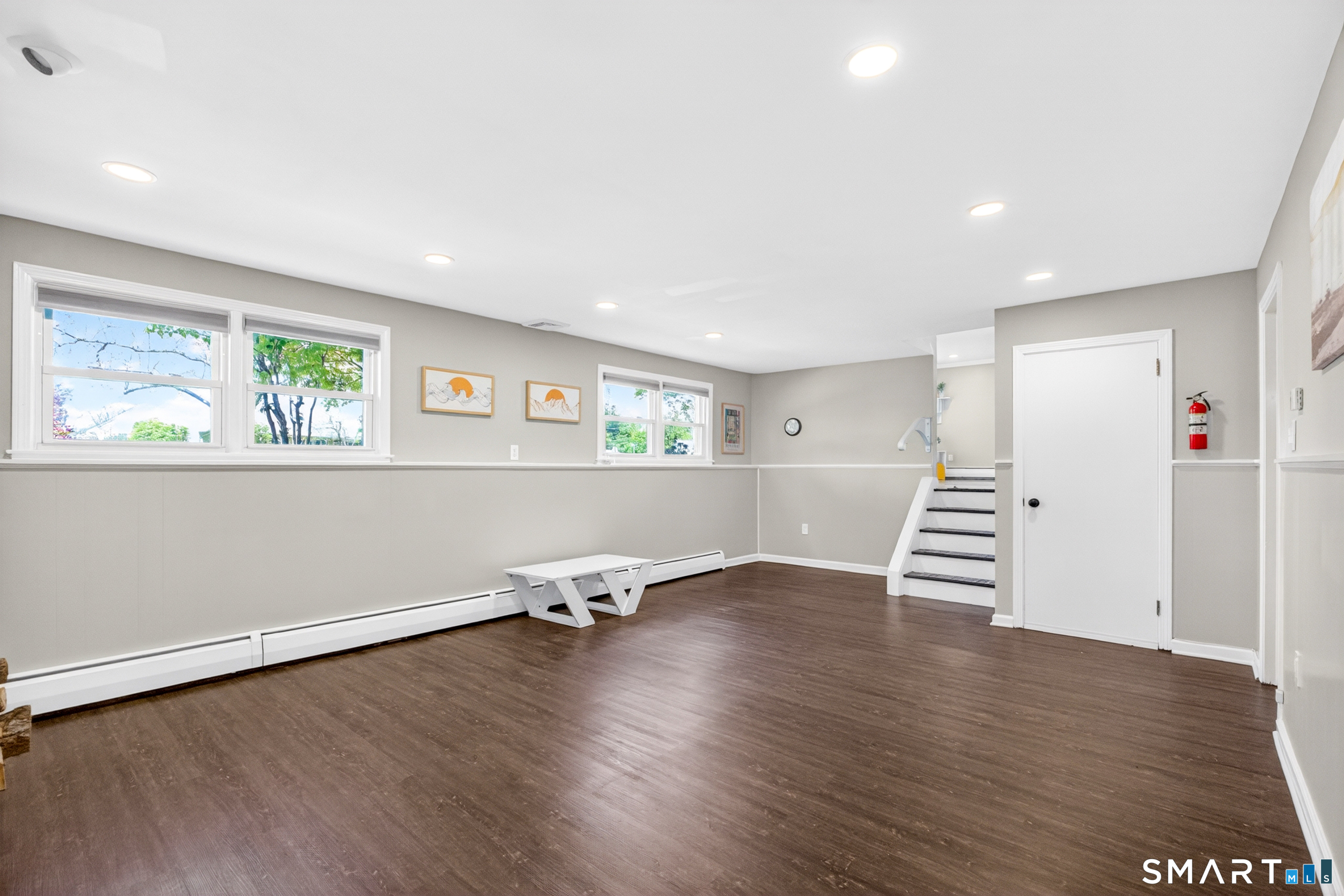 568 Wiese Road Cheshire, CT 06410 - Photo 17 of 40 an empty room with wooden floor and windows