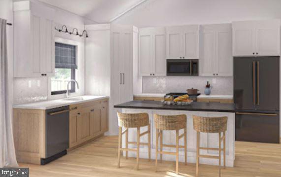 Lot#3 Davis Valley Road Stewartstown, PA 17363 - Photo 12 of 22 a kitchen with stainless steel appliances granite countertop a stove refrigerator sink and cabinets