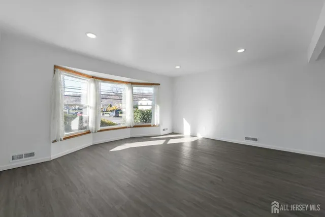 a view of wooden balcony and trees