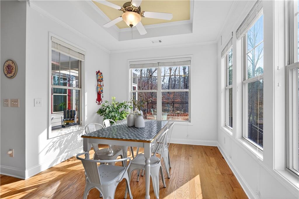 310 Pepperwood Way Canton, GA 30114 - Photo 15 of 54 a view of a dining room with furniture window and wooden floor