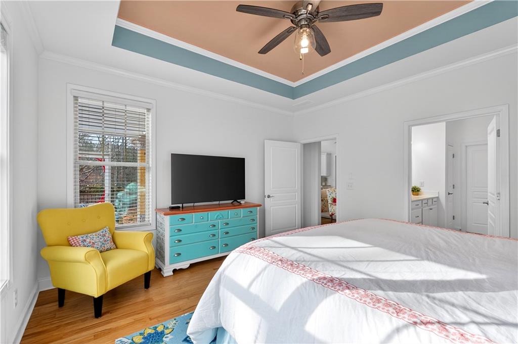 310 Pepperwood Way Canton, GA 30114 - Photo 23 of 54 a bedroom with a bed and a flat screen tv