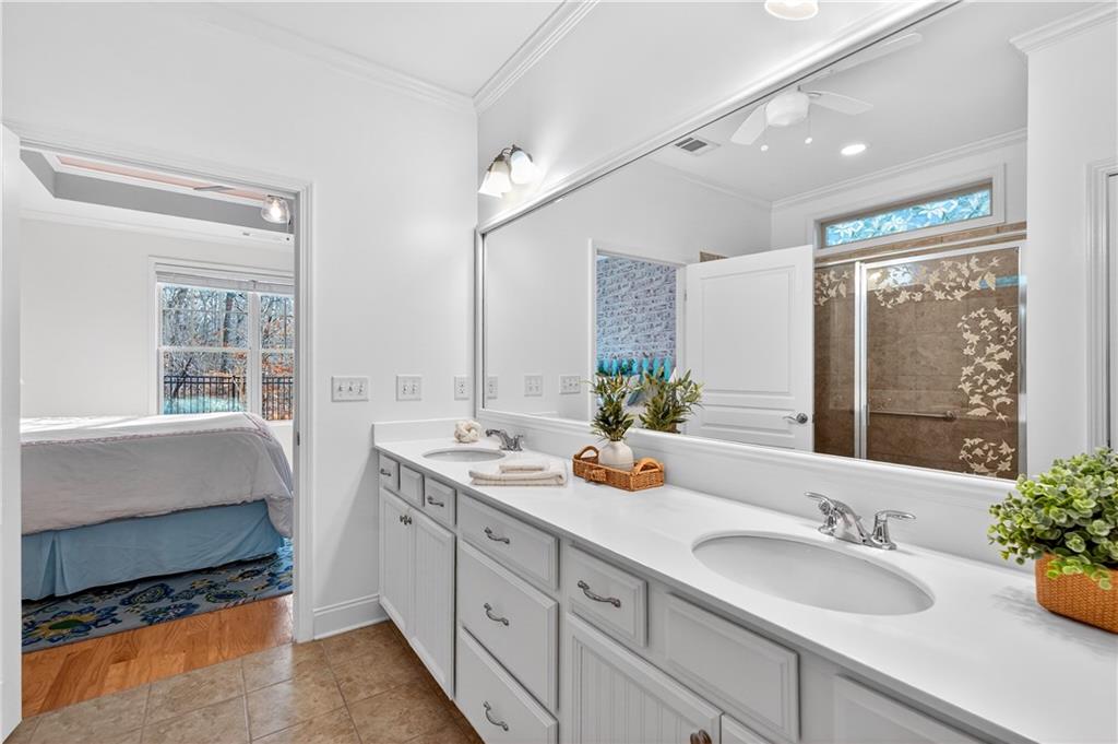 310 Pepperwood Way Canton, GA 30114 - Photo 24 of 54 a bathroom with a granite countertop sink and a large mirror
