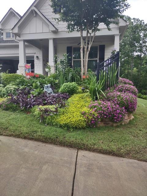 310 Pepperwood Way Canton, GA 30114 - Photo 41 of 54 a front view of a house with a garden