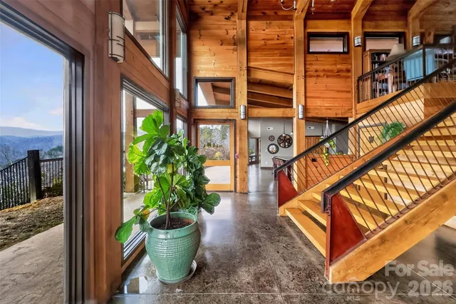 a view of a chairs and table in the balcony
