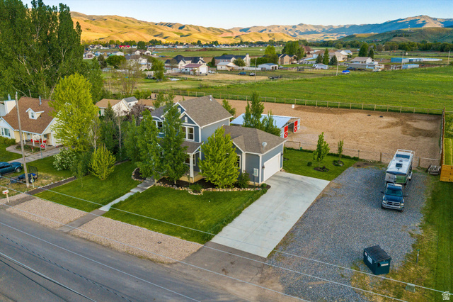 681 Island Road Morgan, UT 84050 - Photo 40 of 49 Two-story residence featuring a gray exterior, white trim, and an attached two-car garage