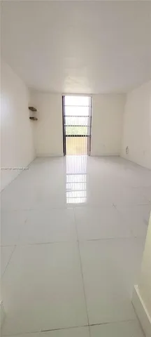 a view of workspace with hardwood floor and windows