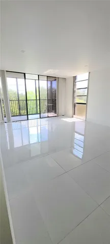 a view of livingroom with furniture and floor to ceiling window