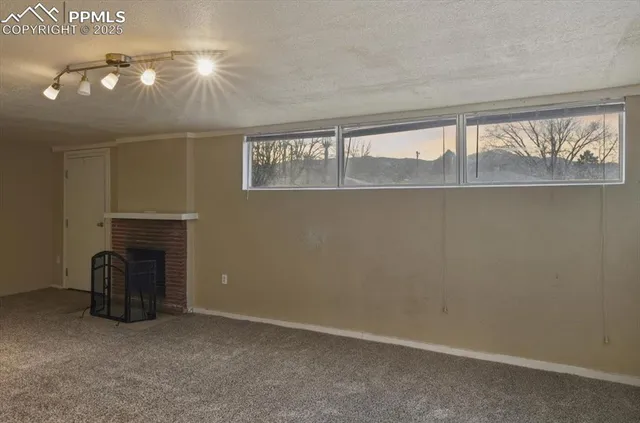 an empty room with windows and entrance