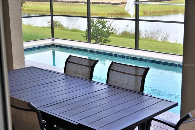 a room with wooden floor and windows