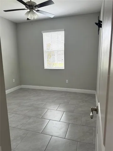 a view of an empty room with a window