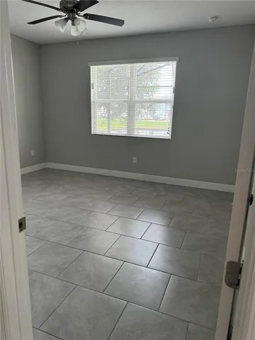 a view of an empty room with a window