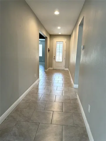 a house that has a tree in front of it