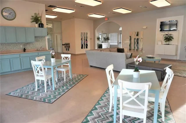 a view of a room with furniture and wooden floor