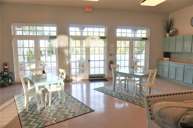 a view of a swimming pool with an outdoor seating