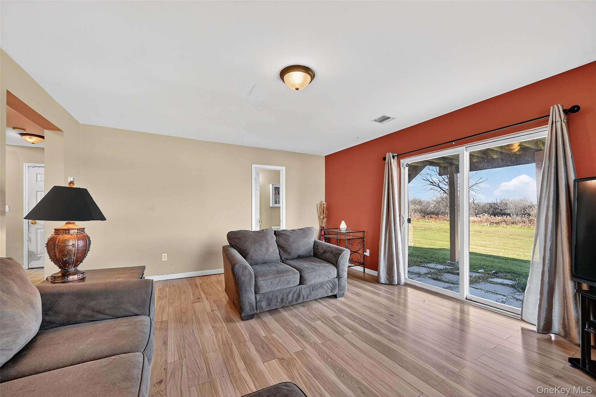 913 Silver Lake Sctn Road Middletown, NY 10941 - Photo 20 of 29 a living room with furniture and wooden floor