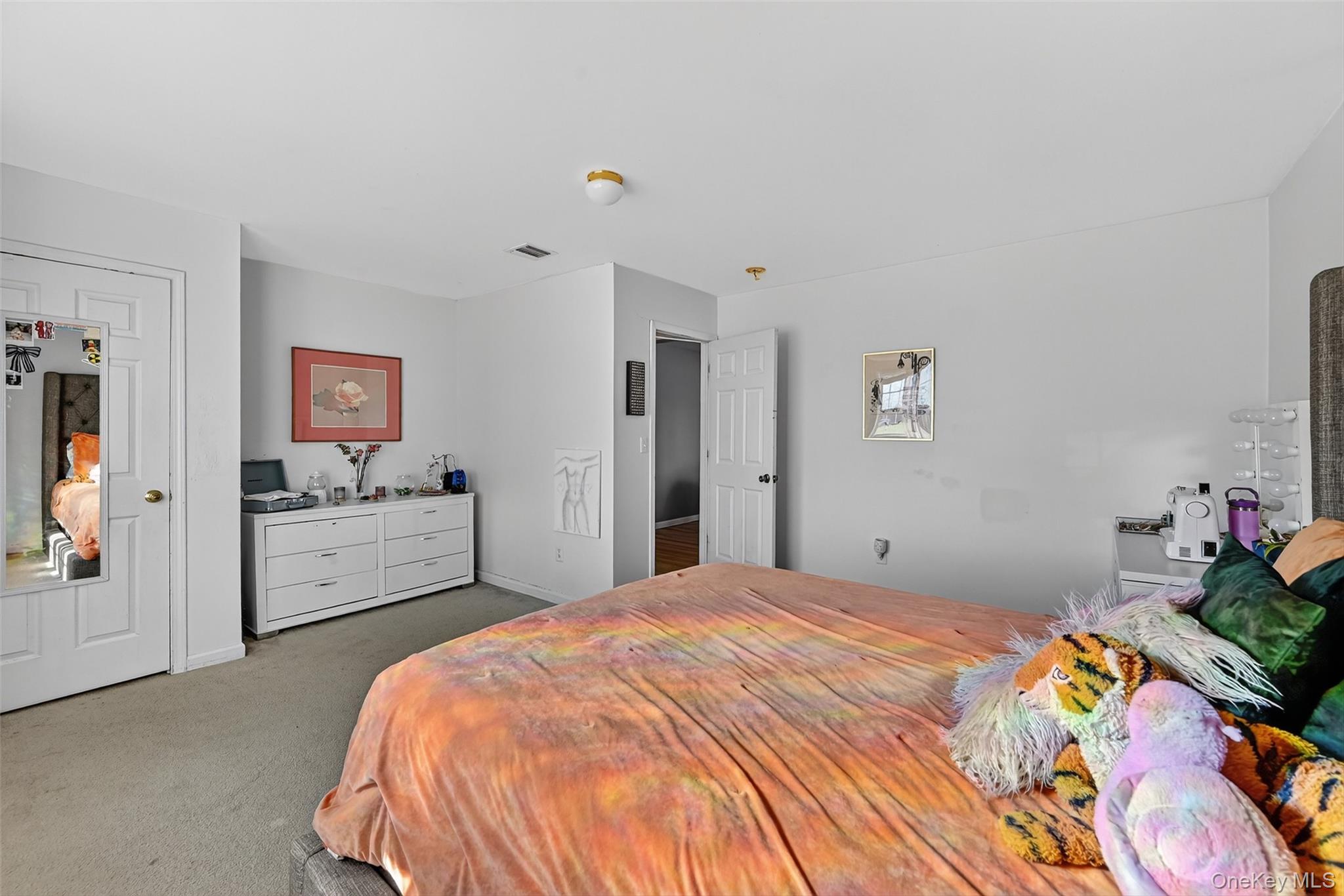 913 Silver Lake Sctn Road Middletown, NY 10941 - Photo 22 of 29 a bedroom with a bed and a potted plant