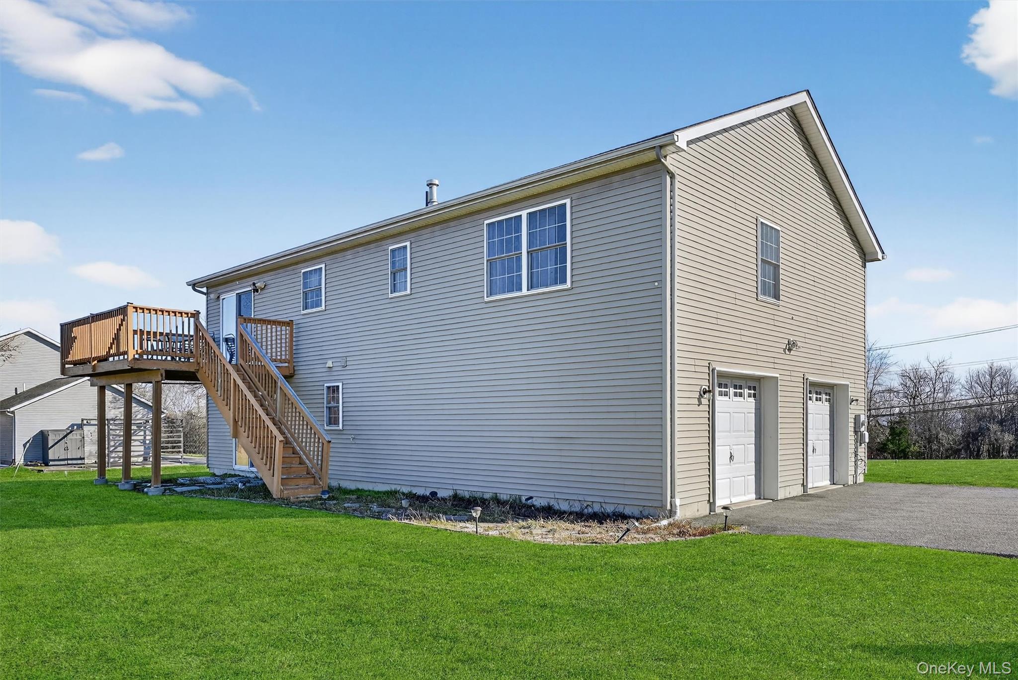913 Silver Lake Sctn Road Middletown, NY 10941 - Photo 28 of 29 a backyard of a house with lots of green space and plants